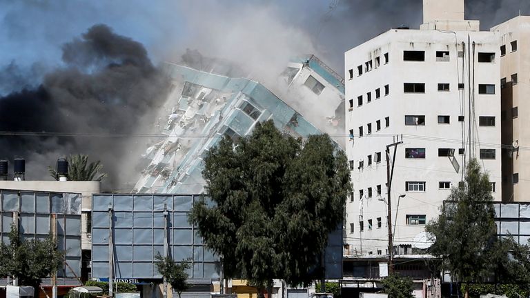 A tower housing AP, Al Jazeera offices collapses after Israeli missile strikes in Gaza city,