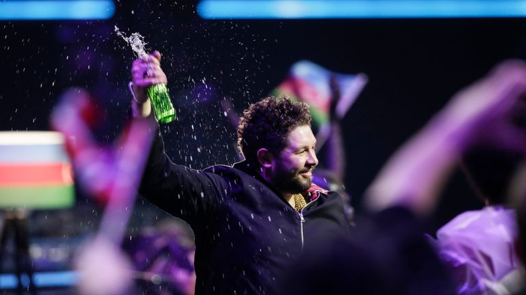 James Newman from the United Kingdom reacts after receiving zero points during voting at the Grand Final of the Eurovision Song Contest at Ahoy arena in Rotterdam, Netherlands, Saturday, May 22, 2021. (AP Photo/Peter Dejong)