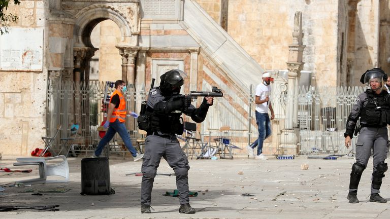 Israeli police clash with Palestinians at the compound that houses Al-Aqsa Mosque in Jerusalem