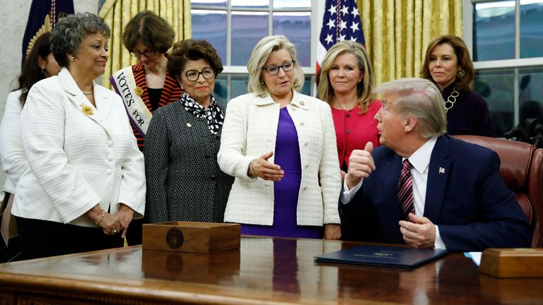 Liz Cheney, in the purple dress, has been a vocal critic of Donald Trump. Pic: Associated Press