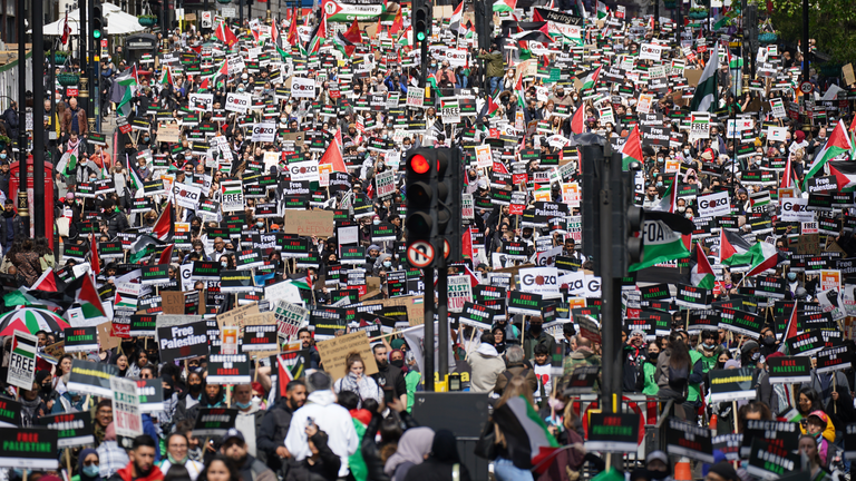 Protesters walk along Piccadily in central London, during a march in solidarity with the people of Palestine, following a ceasefire agreement between Hamas and Israel. Picture date: Saturday May 22, 2021.