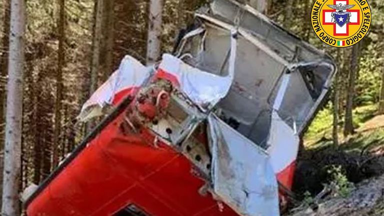 The cable car was crushed on the side of the mountain. Pic: National Alpine and Speleological Rescue Corps