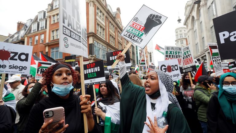 Pro-Palestinian demonstrators attend a protest following a flare-up of Israeli-Palestinian violence, in London, Britain, May 15, 2021. REUTERS/Peter Nicholls