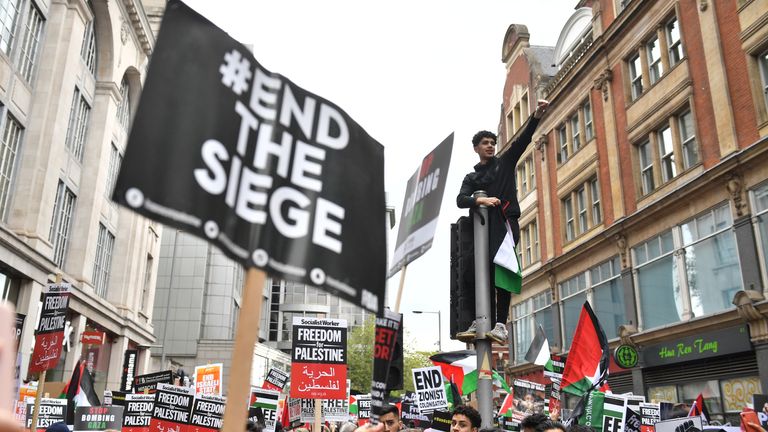 Demonstrators on Kensington High Street, as they protest near to the Israeli embassy in London, during a march in solidarity with the people of Palestine amid the ongoing conflict with Israel. Picture date: Saturday May 15, 2021.