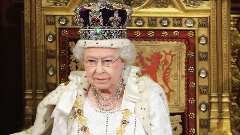 Queen Elizabeth waits to read the Queen&#39;s Speech to lawmakers in the House of Lords during the State Opening of Parliament in central London May 9, 2012