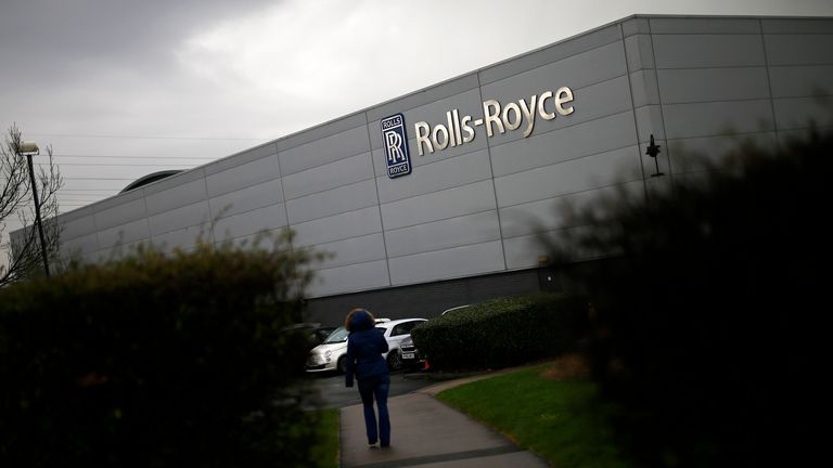 A worker walks into a Rolls Royce site in Derby, Britain February 12, 2016