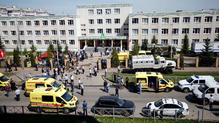 Police and emergency services at the scene of the school shooting in Kazan, Russia, as students are evacuated. Pic: AP