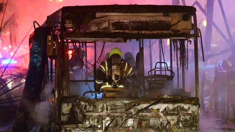 A bus is seen burnt out after the strikes in Holon. Pic: AP