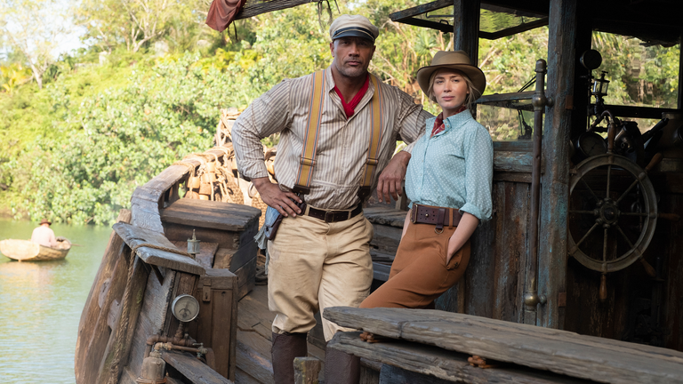 This image released by Disney shows Dwayne Johnson, left, and Emily Blunt in "Jungle cruise." (Frank Masi / Disney via AP)