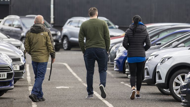 Potential customers walk around Charles Hurst Usedirect used car dealership on Boucher Road in Belfast as restrictions in Northern Ireland ease allowing new and used cars sales. 12/4/2021