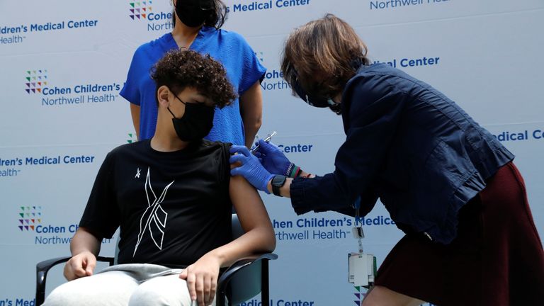 Michael Binparuis (15) of Nesconsit, New York, receives a dose of the Pfizer-BioNTech vaccine for the coronavirus disease (COVID-19) at Northwell Health&#39;s Cohen Children&#39;s Medical Center in New Hyde Park, New York, U.S., May 13, 2021. REUTERS/Shannon Stapleton