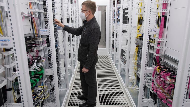 A technician works on the servers at Vodafone's first 5G 'standalone' site in Frankfurt. Pic: AP