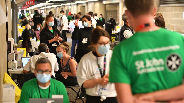 People queue up to receive a coronavirus vaccination at Twickenham rugby stadium, south-west London, where up to 15,000 doses are ready to be administered at the walk-in centre which has been set up for residents of north-west London in response to an increase in the number of cases of coronavirus in the area. Picture date: Monday May 31, 2021.