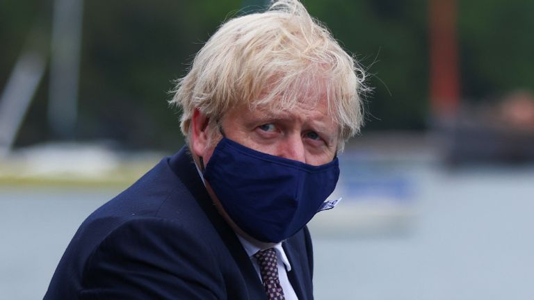 Prime Minister Boris Johnson arrives by boat for a visit to the workshop of Scott Woyka Furniture in Falmouth, ahead of the G7 summit in Cornwall. Picture date: Thursday June 10, 2021.