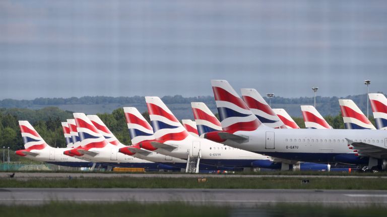 British Airways planes grounded due to the coronavirus outbreak are parked at Gatwick Airport in Sussex.