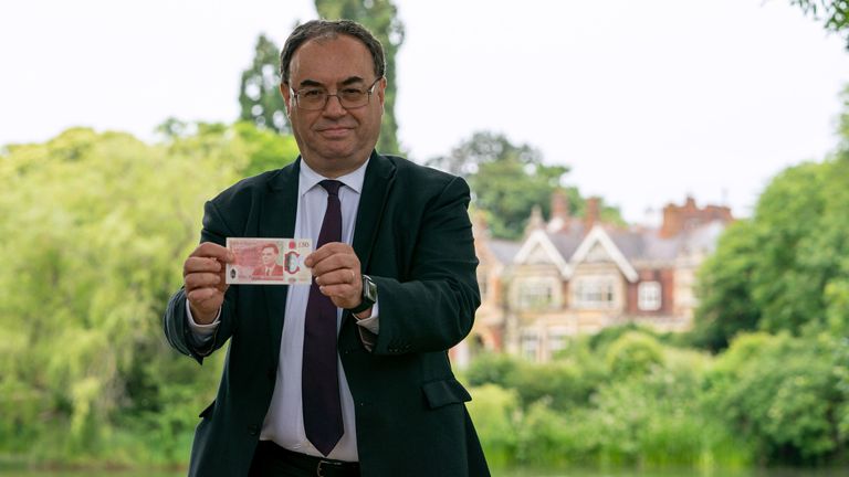 Governor of the Bank of England Andrew Bailey holds up the new £50 note