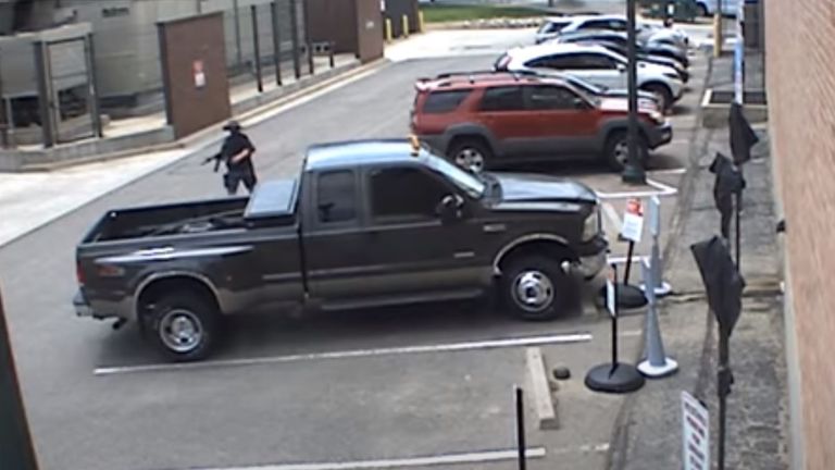 The gunman returned to his pick-up to get another weapon. Pic: Arvada Police Department