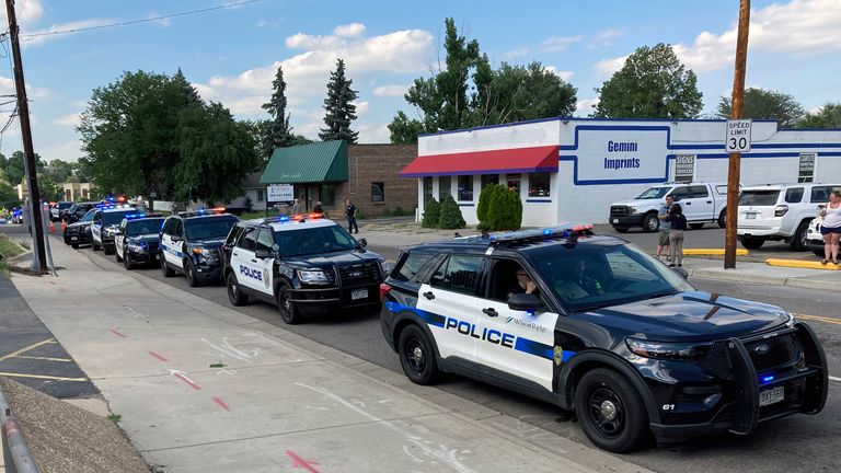 Police cars line up to pay tribute to Gordon Beesley. Pic: AP