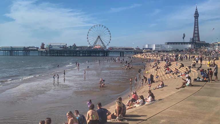 People enjoy the sunshine at Blackpool beach, as Bank Holiday Monday could be the hottest day of the year so far - with temperatures predicted to hit 25C in parts of the UK