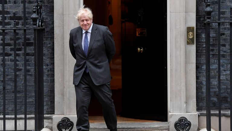 Boris Johnson stands outside Number 10