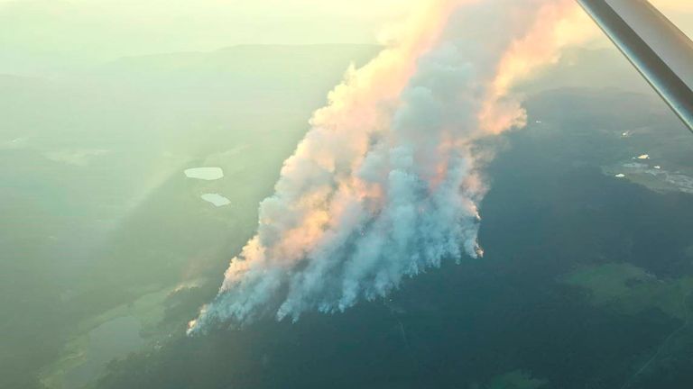 Smoke billows at Thompson-Nicola Regional District in British Columbia during the Sparks Lake wildfire