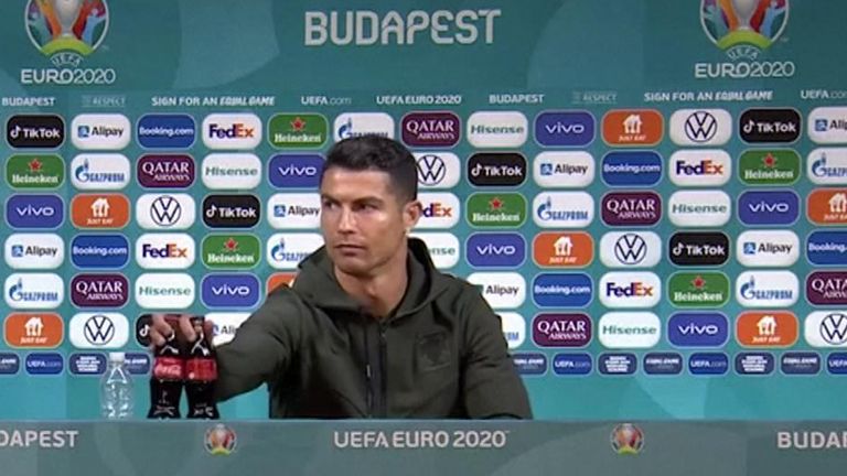  Portuguese soccer superstar Cristiano Ronaldo removed two bottles of tournament sponsors Coca-Cola away from him as he entered a news conference on Monday (June 14) before holding up a bottle of water to the media, dismissing the famous sugary drink.