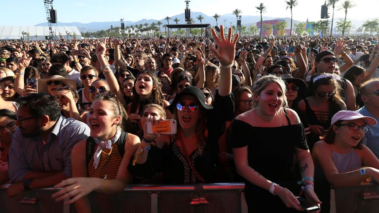 People dance while the band Bastille, performs during the Coachella Valley Music and Arts Festival in Indio, California, U.S. April 15, 2017. REUTERS/Carlo Allegri