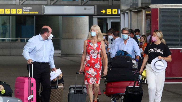 British arrivals at the airport in the capital of the Costa del Sol, after the UK imposed a quarantine on all travellers from Spain. In Malaga (Andalusia, Spain), on 27 July 2020. 27 JULY 2020 Álex Zea / Europa Press 07/27/2020 (Europa Press via AP)