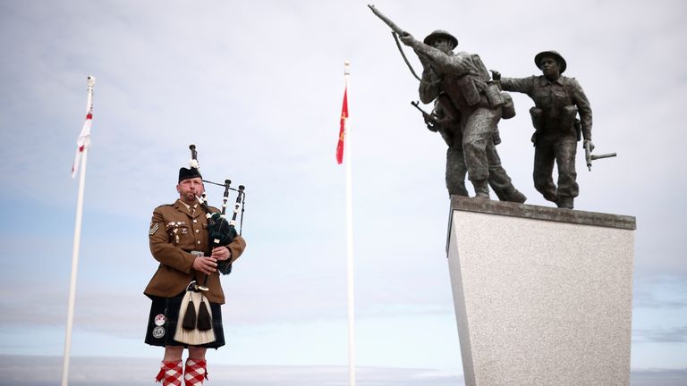 A piper plays before the official opening ceremony of the British Normandy Memorial at Ver-sur-Mer in Normandy