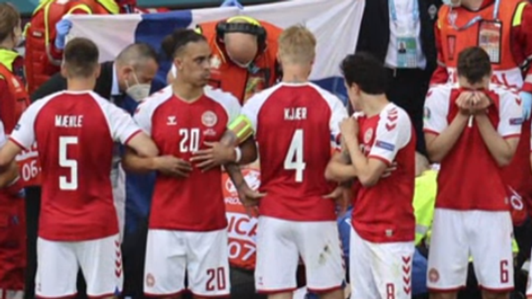 Simon Kjaer (centre) led the Denmark players in shielding Eriksen from the TV cameras