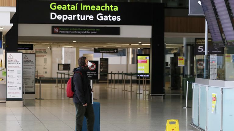 File photo dated 01/05/20 of a man wearing a protective mask in the departures area of â€‹â€‹Terminal 1 at Dublin Airport.  Aer Lingus has announced that a number of regional flights have been canceled after operator Stobart Air terminated its contract with the Irish airline.  Issue date: Saturday June 12, 2021.
