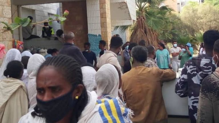 People gather as victims arrive at Ayder Referral Hospital, in Mekelle, after an airstrike in Togoga, Ethiopia&#39;s Tigray region