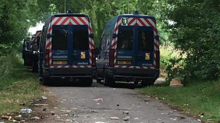 Police vehicles at the rave