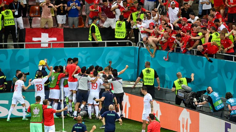 The Swiss players celebrate with their fans after knocking out France Pic: AP