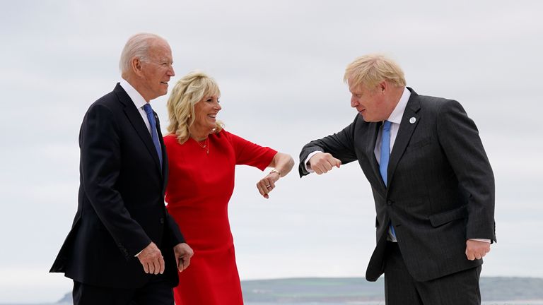 U.S. President Joe Biden and first lady Jill Biden are greeted by British Prime Minister Boris Johnson before posing for photos at the G-7 summit, in Carbis Bay, Britain, June 11, 2021. Patrick Semansky/Pool via REUTERS