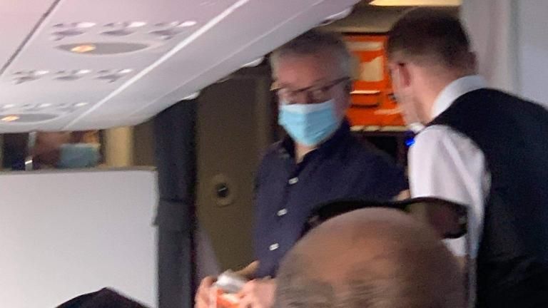 Michael Gove on board the flight back from Portugal