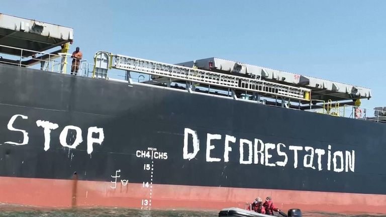Greenpeace activists painted the words &#34;Stop deforestation&#34; on the hull of a cargo ship off the coast of France to protest against imported deforestation.