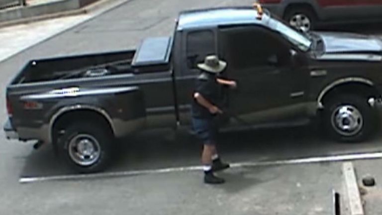 Footage released by Arvada Police Department showed a male suspect walking to his truck to retrieve a weapon.