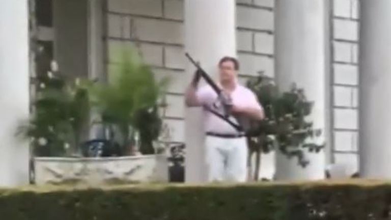 Mark McCloskey waves firearm at protesters in 2020
