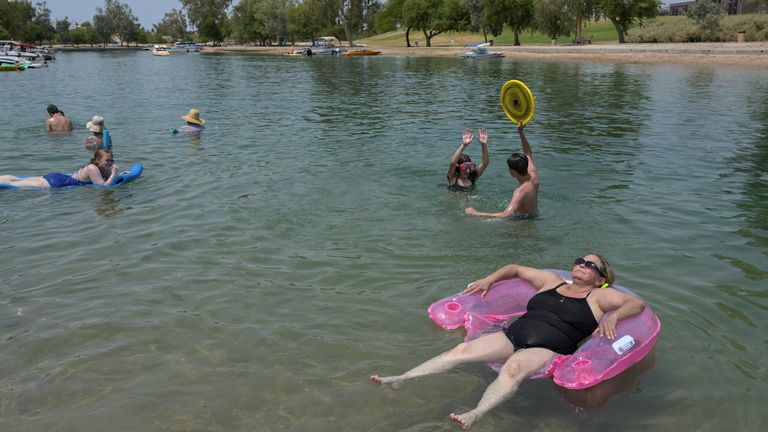 People cool off in the water in Lake Havasu, Arizona