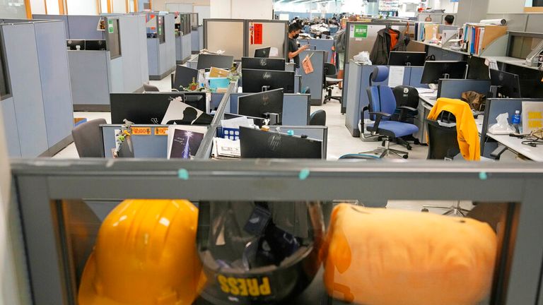 Monitors are left on table after police taking away the computers as evidence in the newsroom 