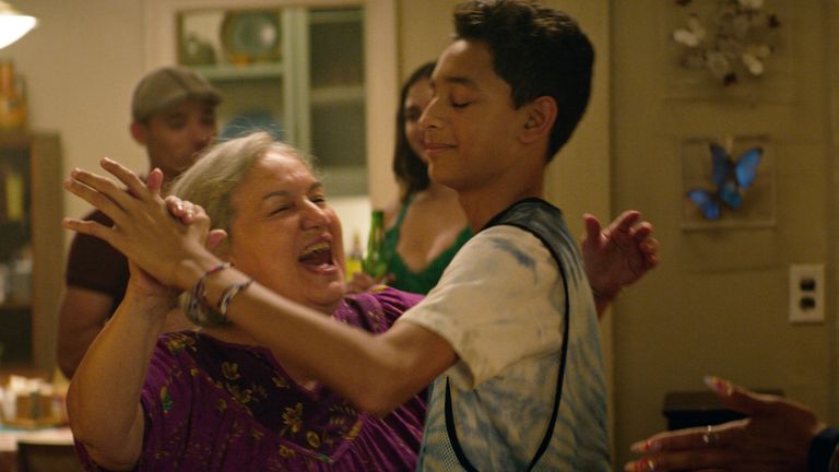 Abuela Claudia (Olga Merediz) and Sonny (Gregory Diaz III) share differing stories of immigration in the film. Pic: Warner Bros Studios