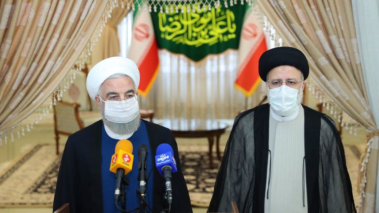 In this photo released by the official website of the office of the Iranian Presidency, President Hassan Rouhani (left), speaks with the media after his meeting with Ebrahim Raisi. Pic AP