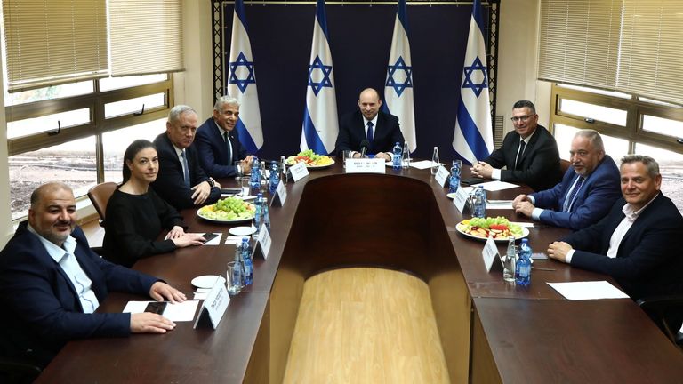 Party leaders of the new coalition government posed for a picture at the Knesset, Israel&#39;s parliament, before the start of a special session to approve and swear-in the coalition government, in Jerusalem