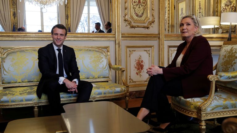 Macron pictured here meeting with Marine Le Pen in 2019. Ms Le Pen party is projected to win at least one region for the first time