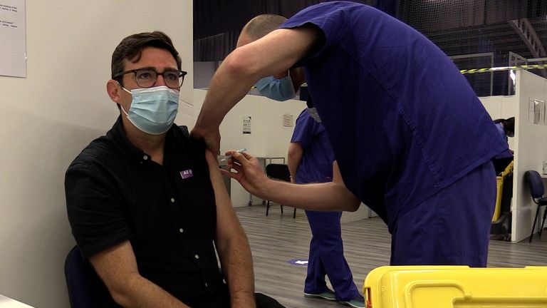 Mayor of Greater Manchester Andy Burnham receives his second vaccine dose at the Etihad Stadium