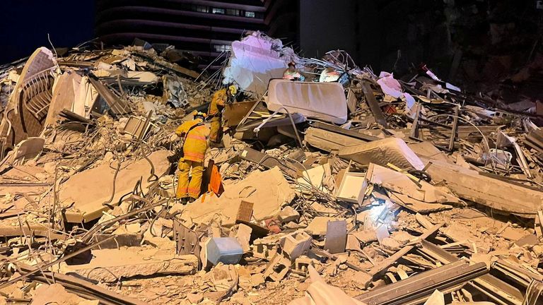 Mattresses can be seen among the rubber after the collapse of the apartment block