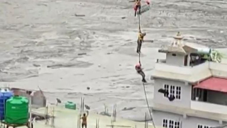 Man is airlifted from rooftop during flash flooding in Nepal
