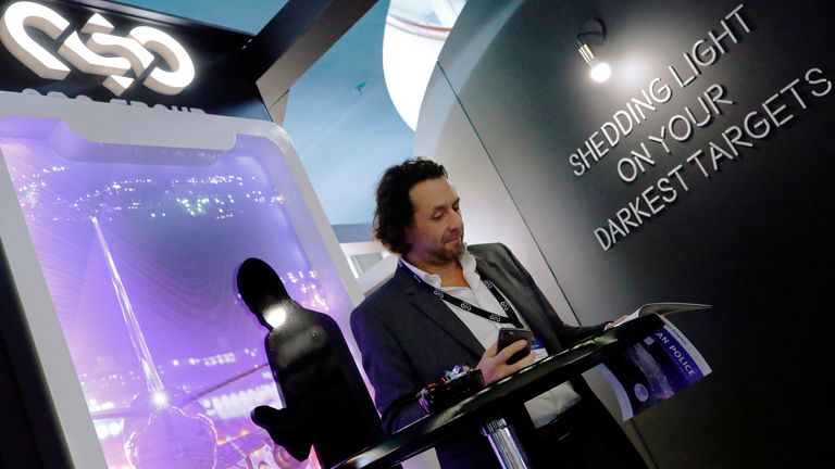 A man reads at a stand of the NSO Group Technologies, an Israeli technology firm known for its Pegasus spyware enabling the remote surveillance of smartphones, at the annual European Police Congress in Berlin, Germany, February 4, 2020