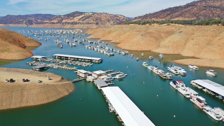 An aerial view shows houseboats anchored in low water levels at Lake Oroville, which is the second largest reservoir in California 